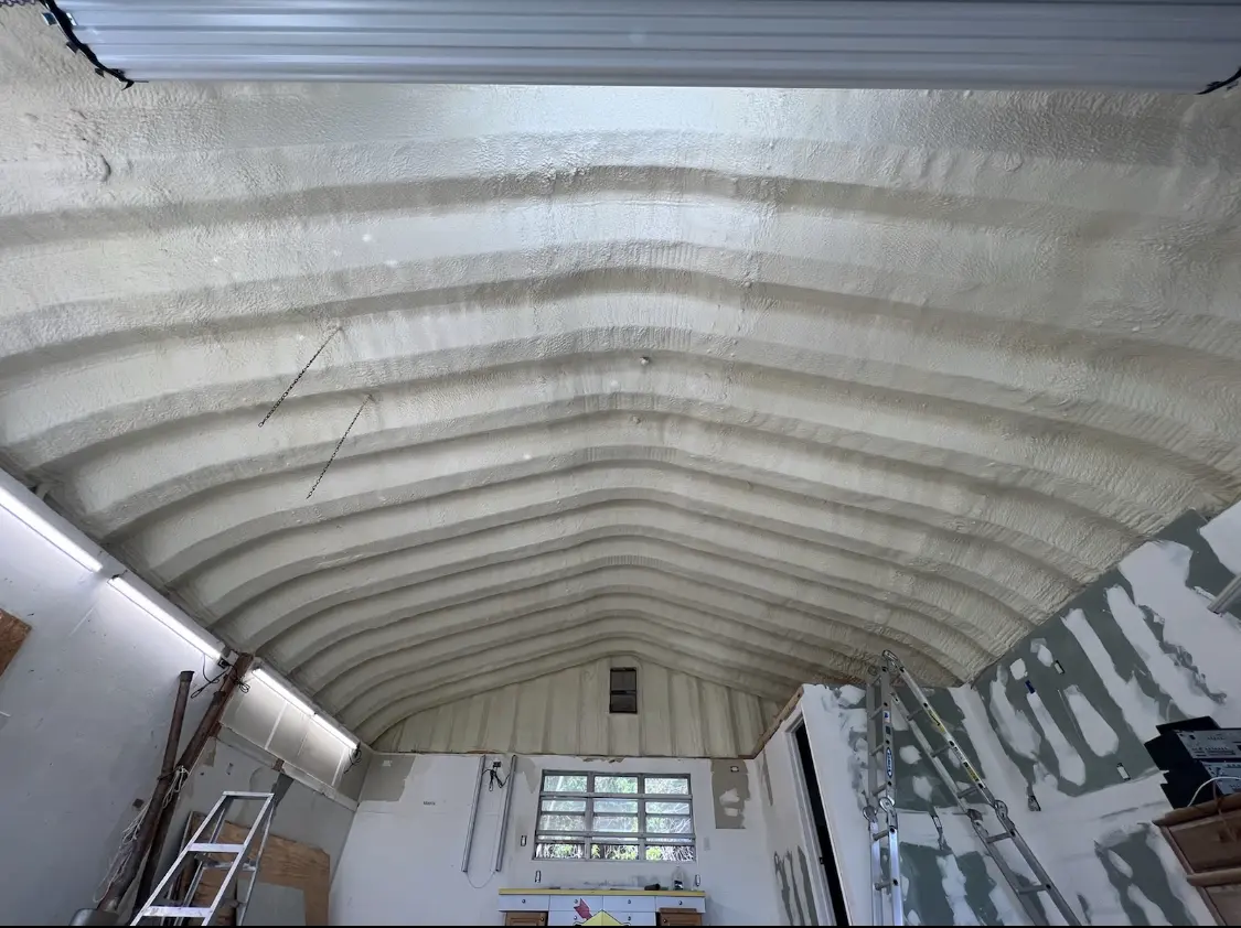 Spray polyurethane foam applied to the underside of a metal roof deck in Danville
